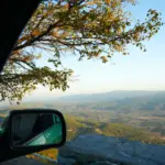 car-is-driving-down-mountain-with-view-mountains